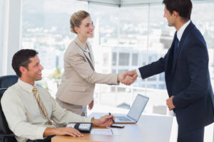 25765277 - business people shaking hands with their future patner in their office